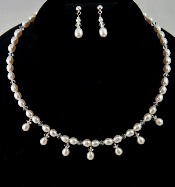 Cultured freshwater pearls and swarovski crystal    $48    earrings  $20